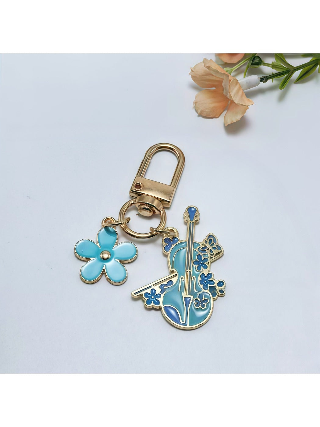Keypus alloy flower harp keychain attached to a set of keys