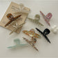 Side view of Beau gradient color claw clip displaying curved design and clasp