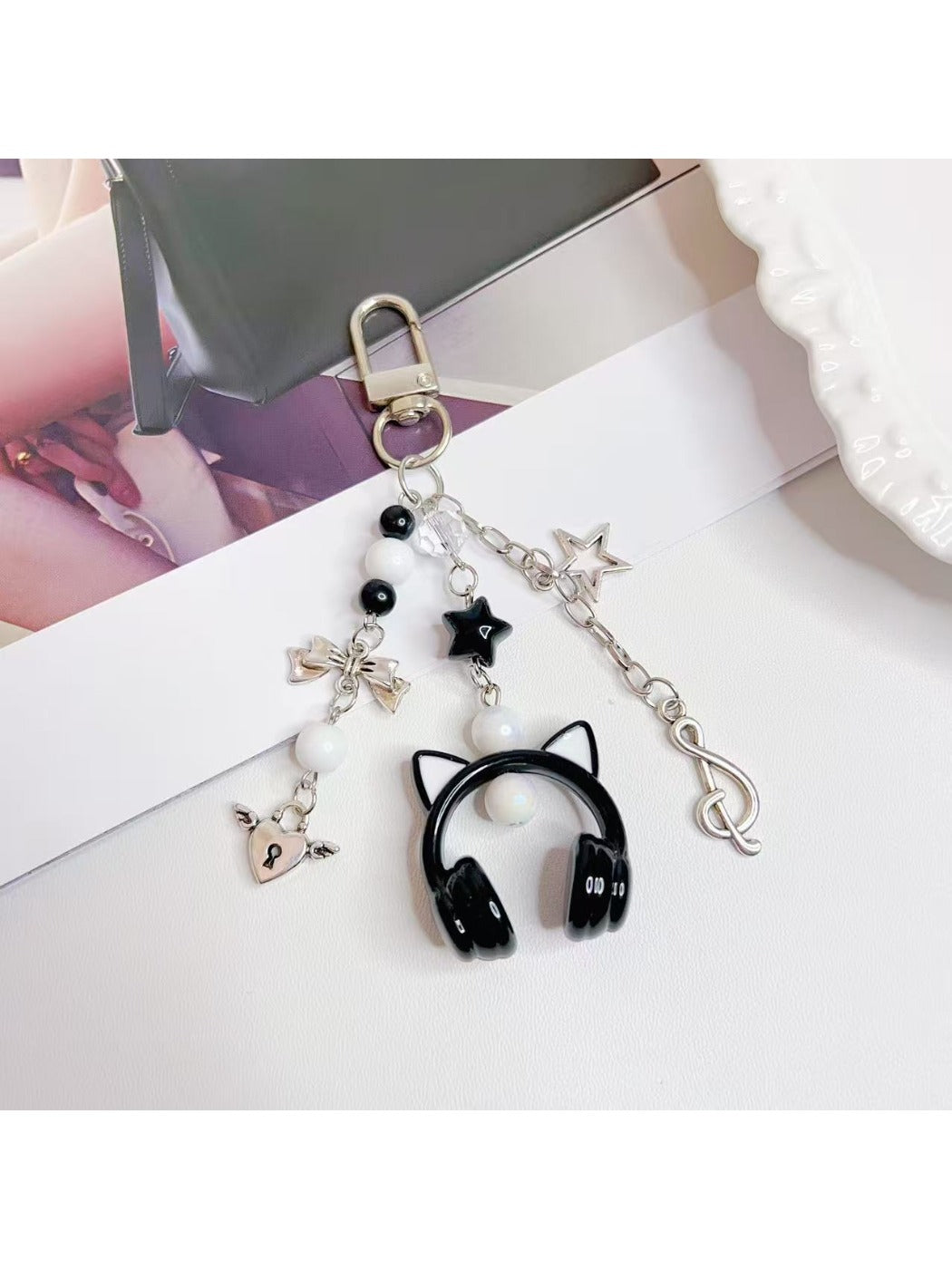Side view of the over ear headphone keychain highlighting its compact size