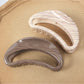 Close-up of Beau semi circular hollow hair clip showing smooth curved design