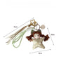 Side view of Keypus fabric cartoon doll keychain highlighting keyring attachment