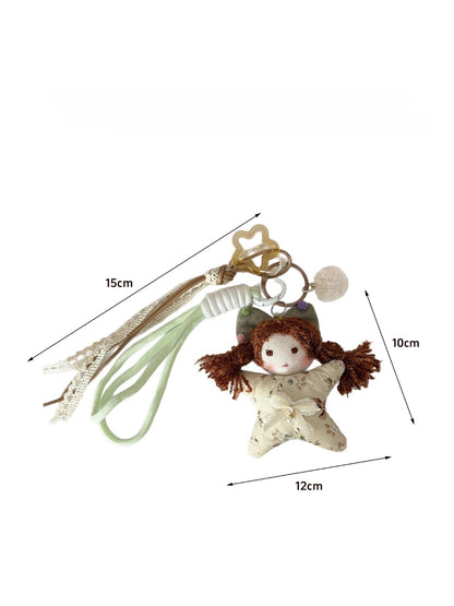 Side view of Keypus fabric cartoon doll keychain highlighting keyring attachment