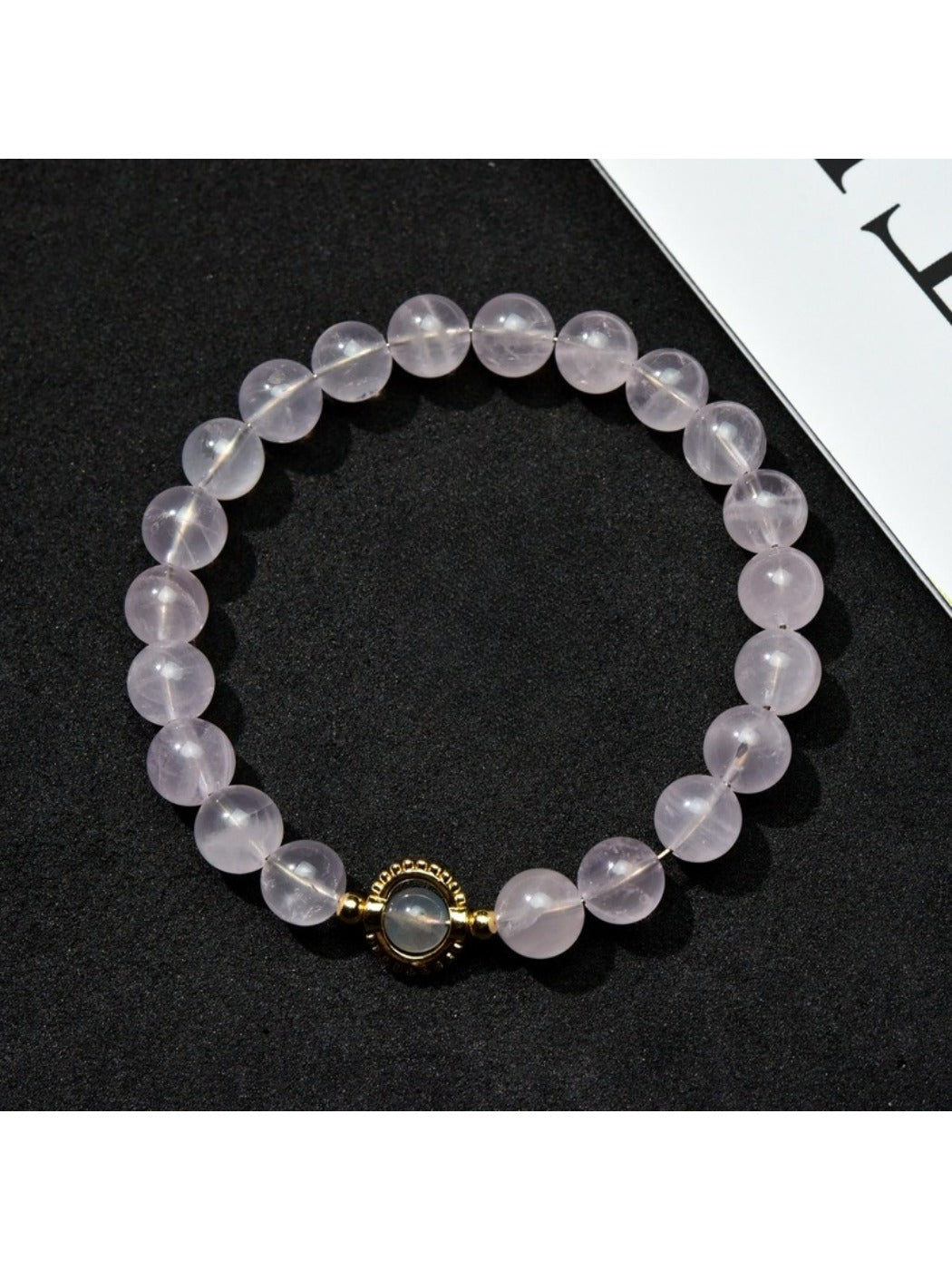 Lovra minimalist pastel beaded bracelet with soft pink and blue beads on a white background