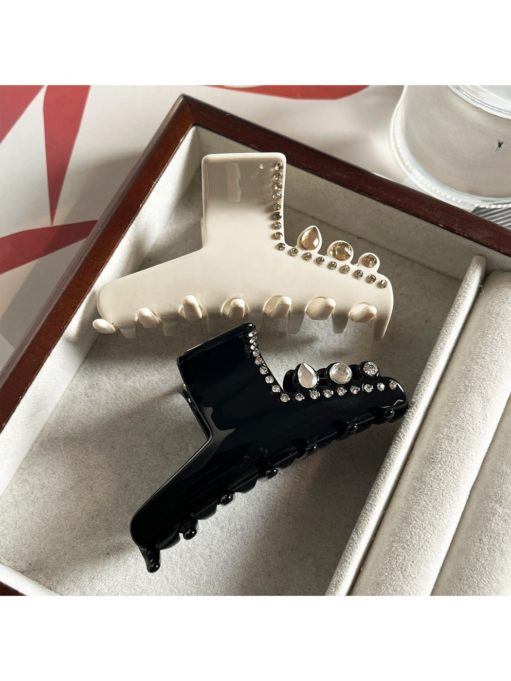 Side view of Beau rhinestone embellished acetate claw clip showing clasp mechanism