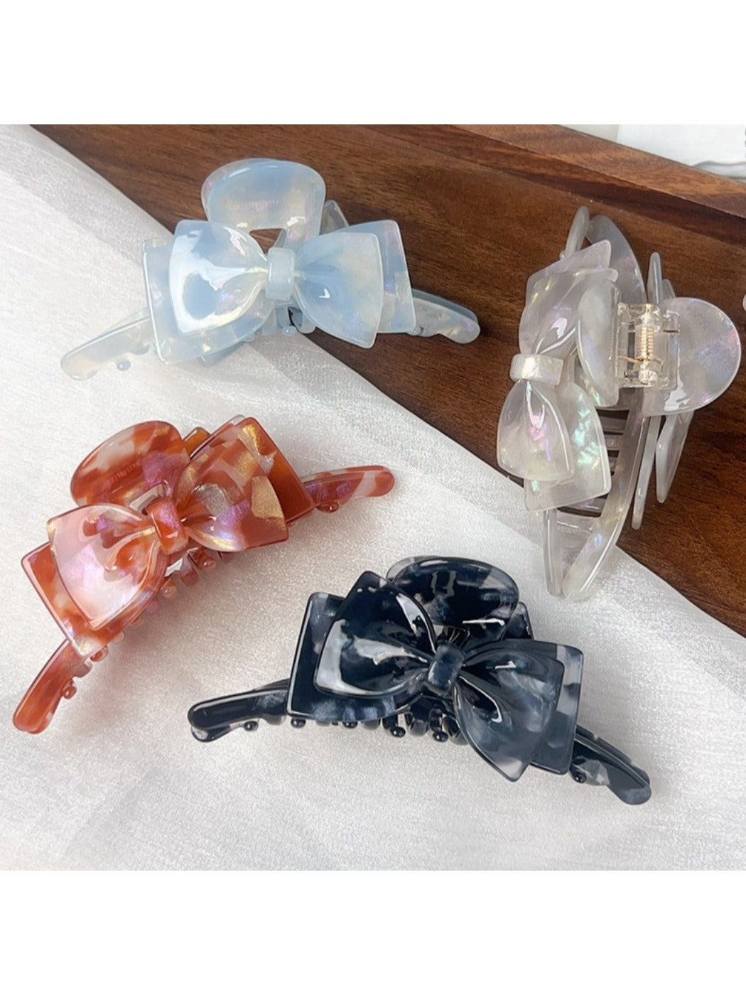 Side view of Beau double layer bow hair claw clip highlighting clip mechanism