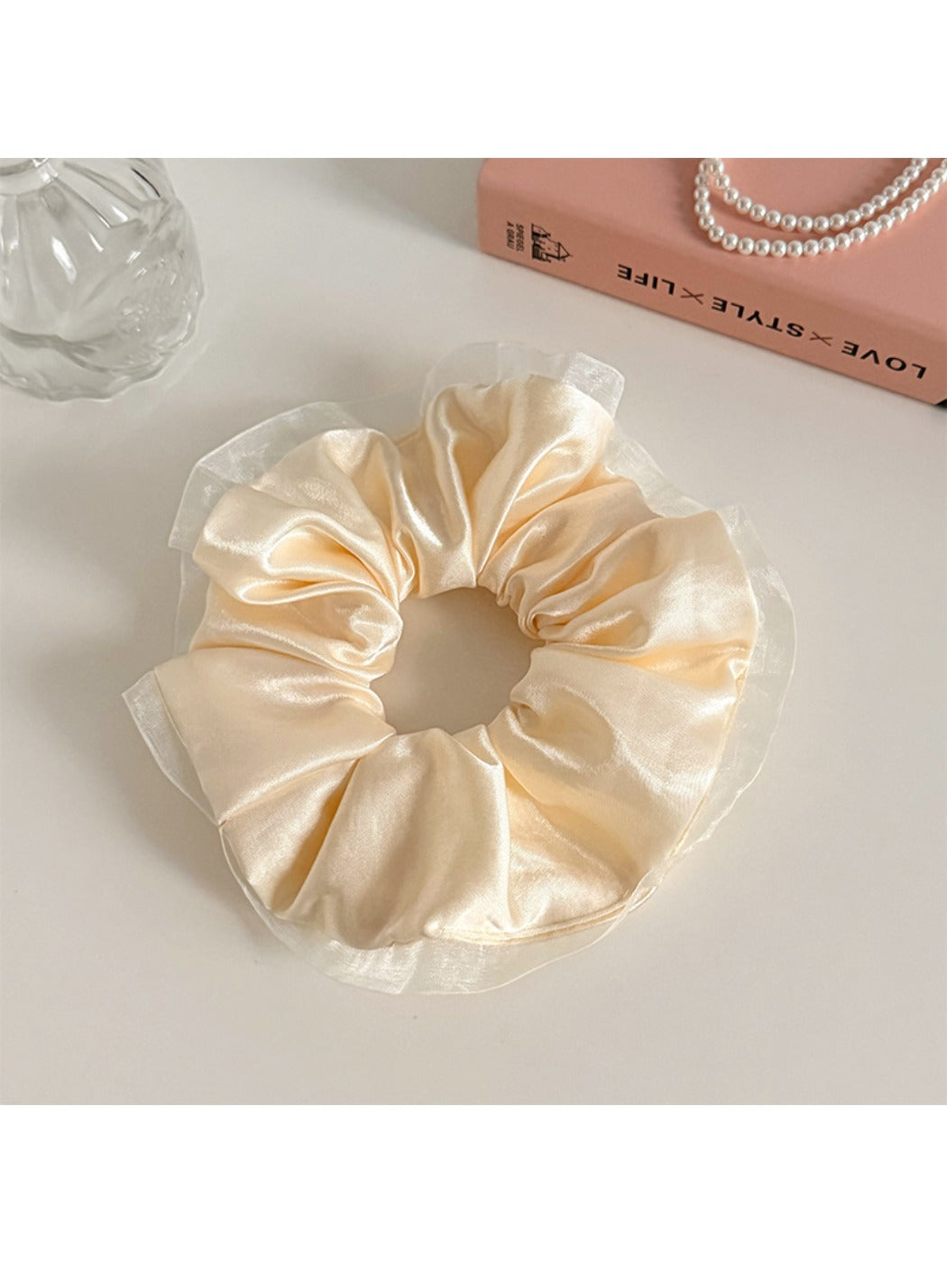 Gifty satin tulle ruffled scrunchie held in hand showing size and fabric details