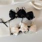 Beau Sweet Bow Banana Clip in light beige with a large bow detail