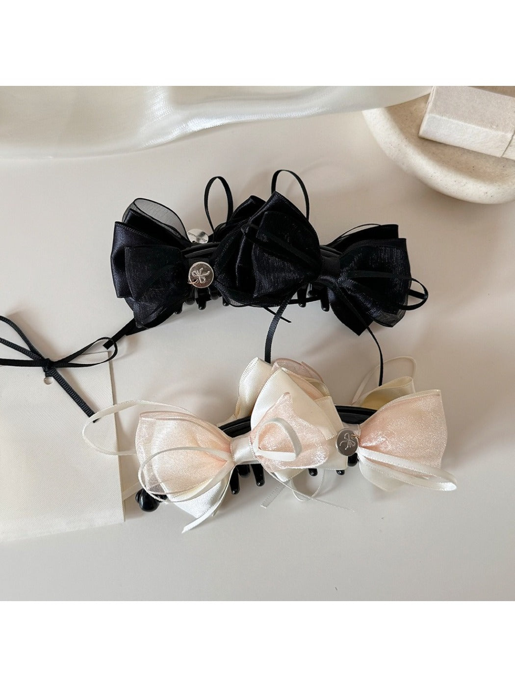 Beau Sweet Bow Banana Clip in light beige with a large bow detail