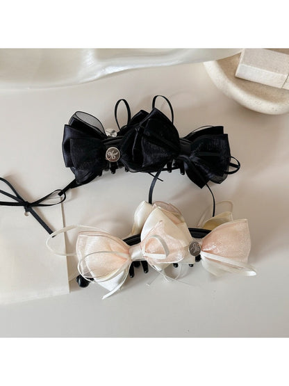 Beau Sweet Bow Banana Clip in light beige with a large bow detail