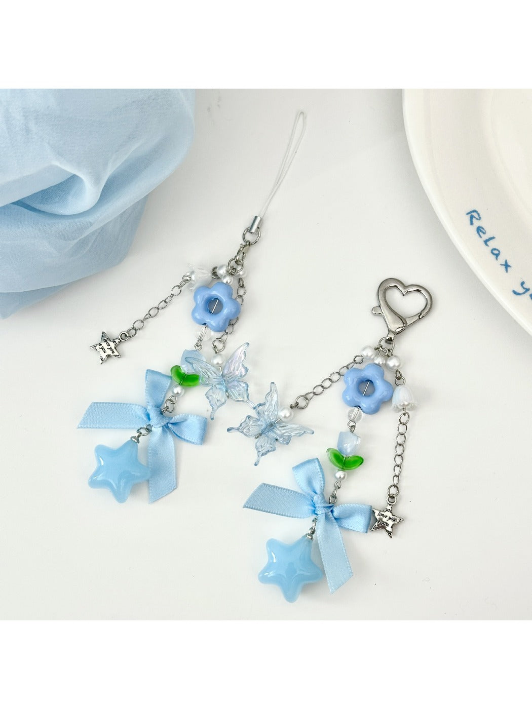 Blue tone flower bow keychain with gold keyring on white background