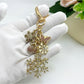 Snowflake pendant keychain displayed on a wooden surface with soft lighting