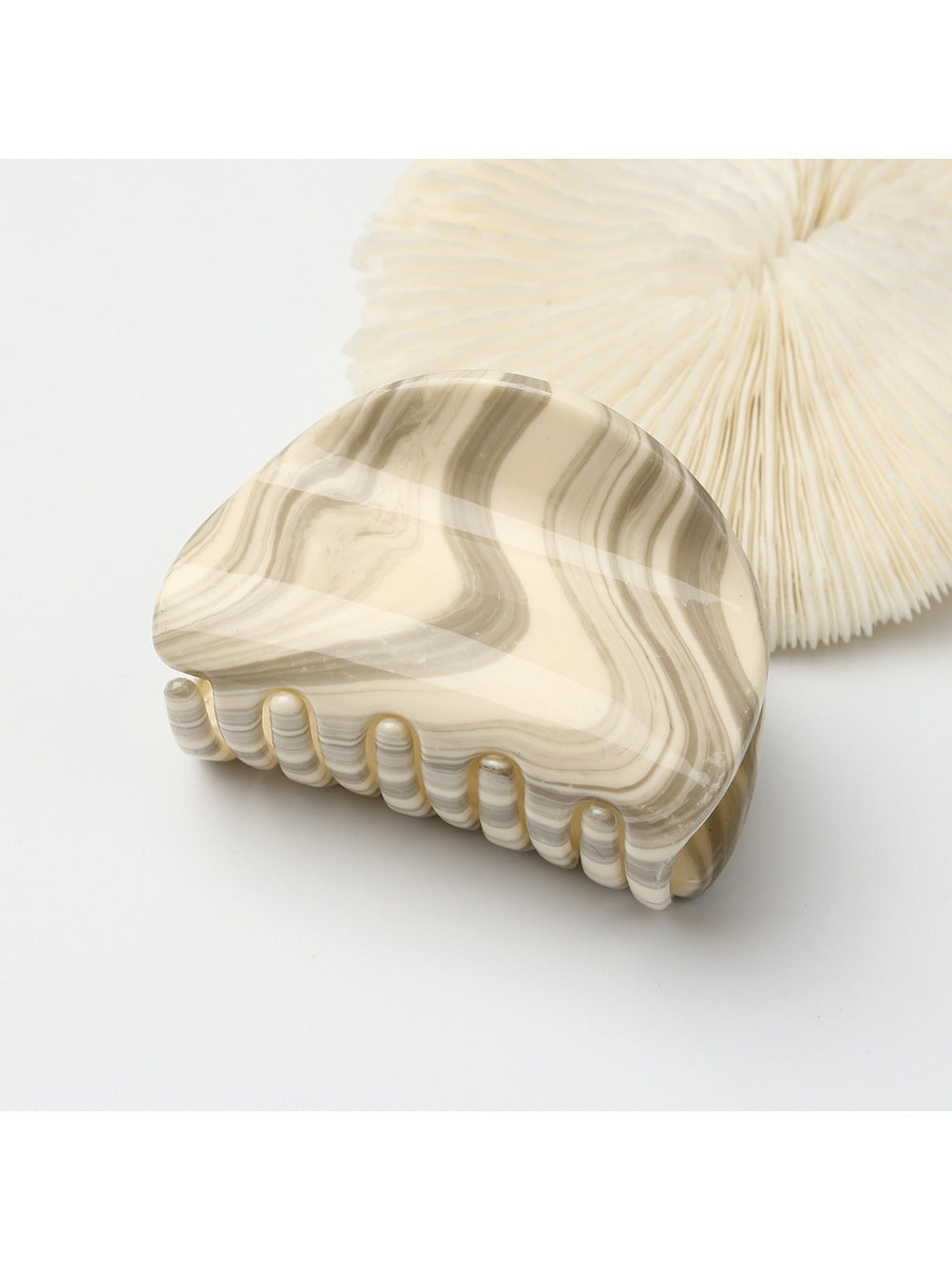 Top view of Beau simple half circle hair clip highlighting curved shape