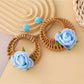 Close-up of earring hook attached to vintage rattan woven circle earring