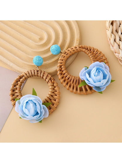 Close-up of earring hook attached to vintage rattan woven circle earring