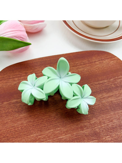 Beau Sweet Three Flower Hair Claw Clip on neutral background with soft lighting