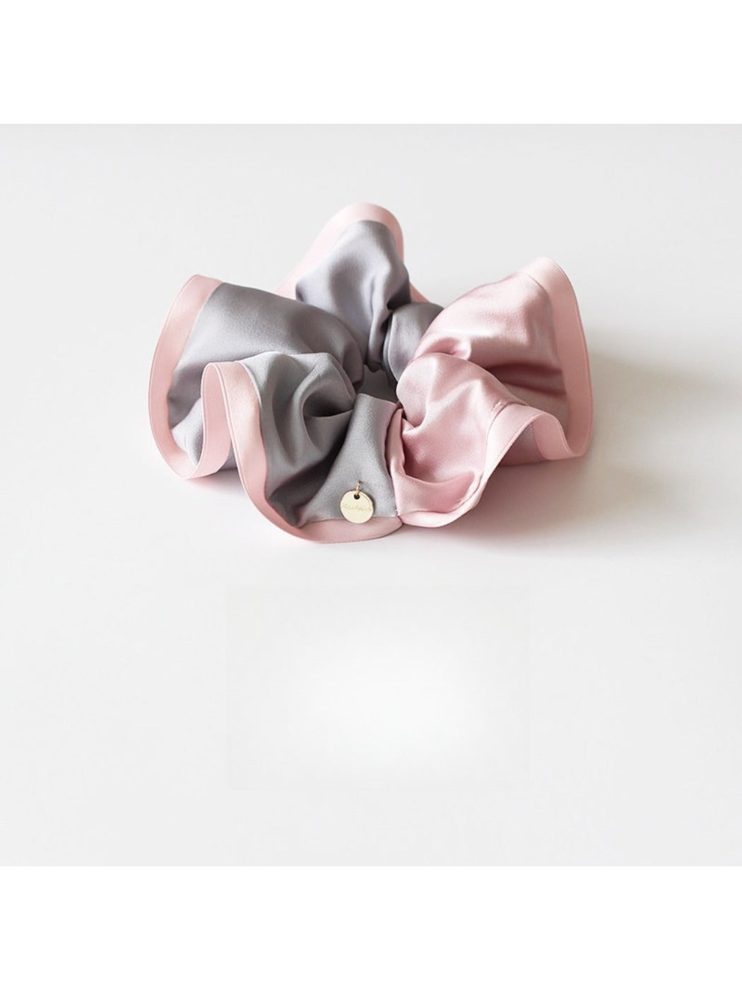 Gifty scrunchie in soft fabric with beige, brown, and cream color blocks
