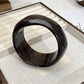 Lovra vintage ombre bangle bracelet displayed on a wooden surface