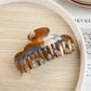 Beau claw clip displayed alongside matching hair accessories