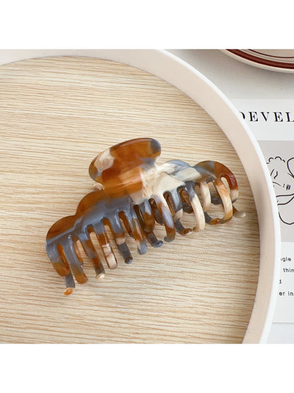 Beau claw clip displayed alongside matching hair accessories