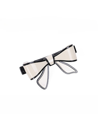 Beau bow hair clip in pastel pink with a subtle sheen on fabric