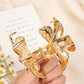 Close-up of Beau flower shaped hair clip showing petal details and clasp mechanism
