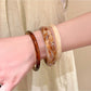 Side view of Lovra vintage ombre wide cuff bangle bracelet