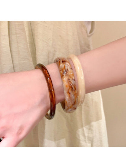 Side view of Lovra vintage ombre wide cuff bangle bracelet