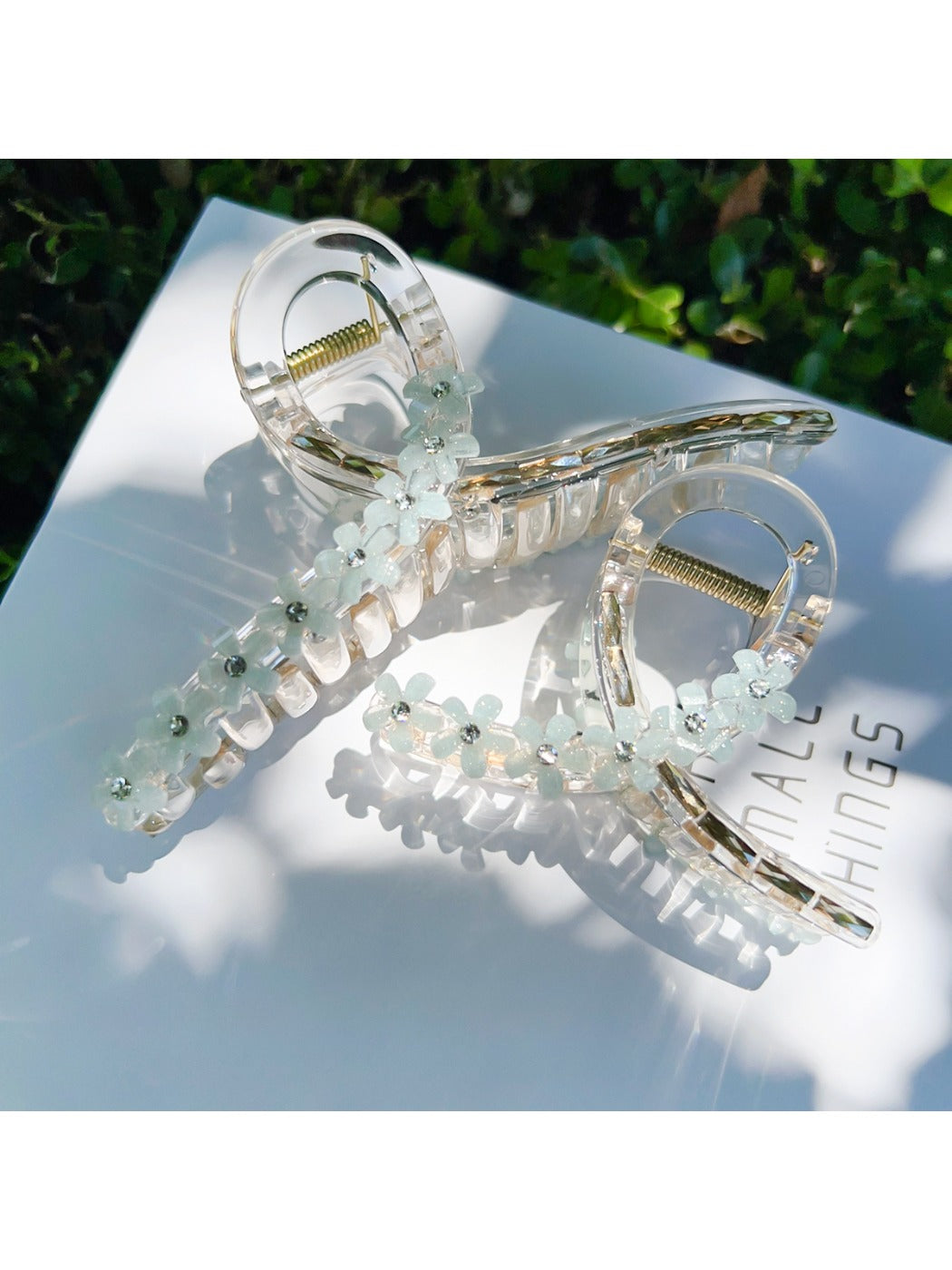 Close-up of Beau flower crisscross hair claw clip showing floral design