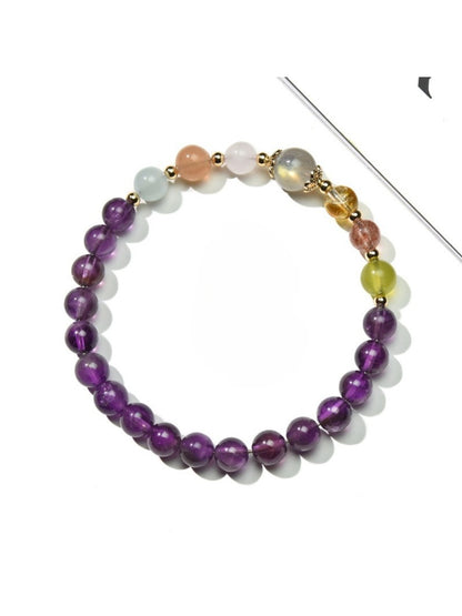 Close-up of Lovra amethyst beaded bracelet showing purple and neutral color blocks