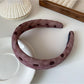 Black and white polka dot ruffled headband styled with casual outfit