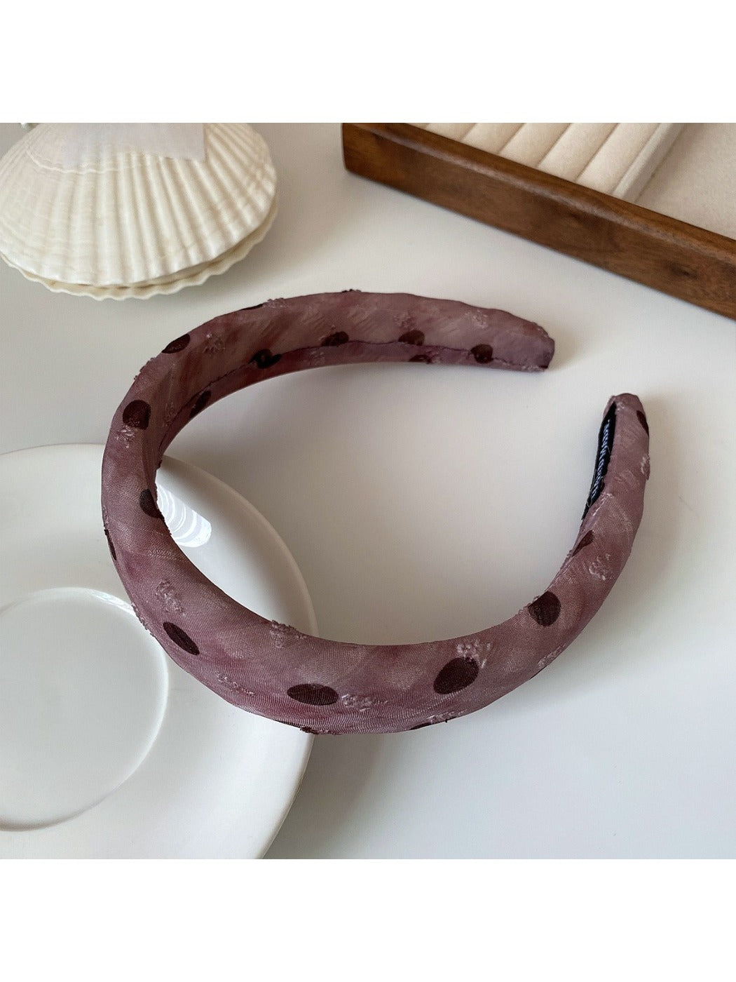 Black and white polka dot ruffled headband styled with casual outfit