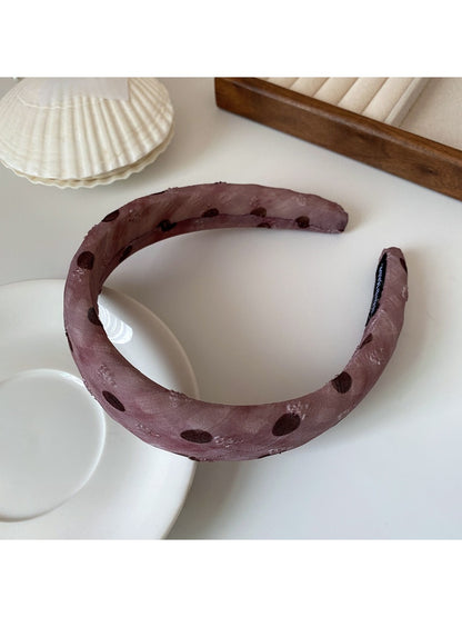 Black and white polka dot ruffled headband styled with casual outfit
