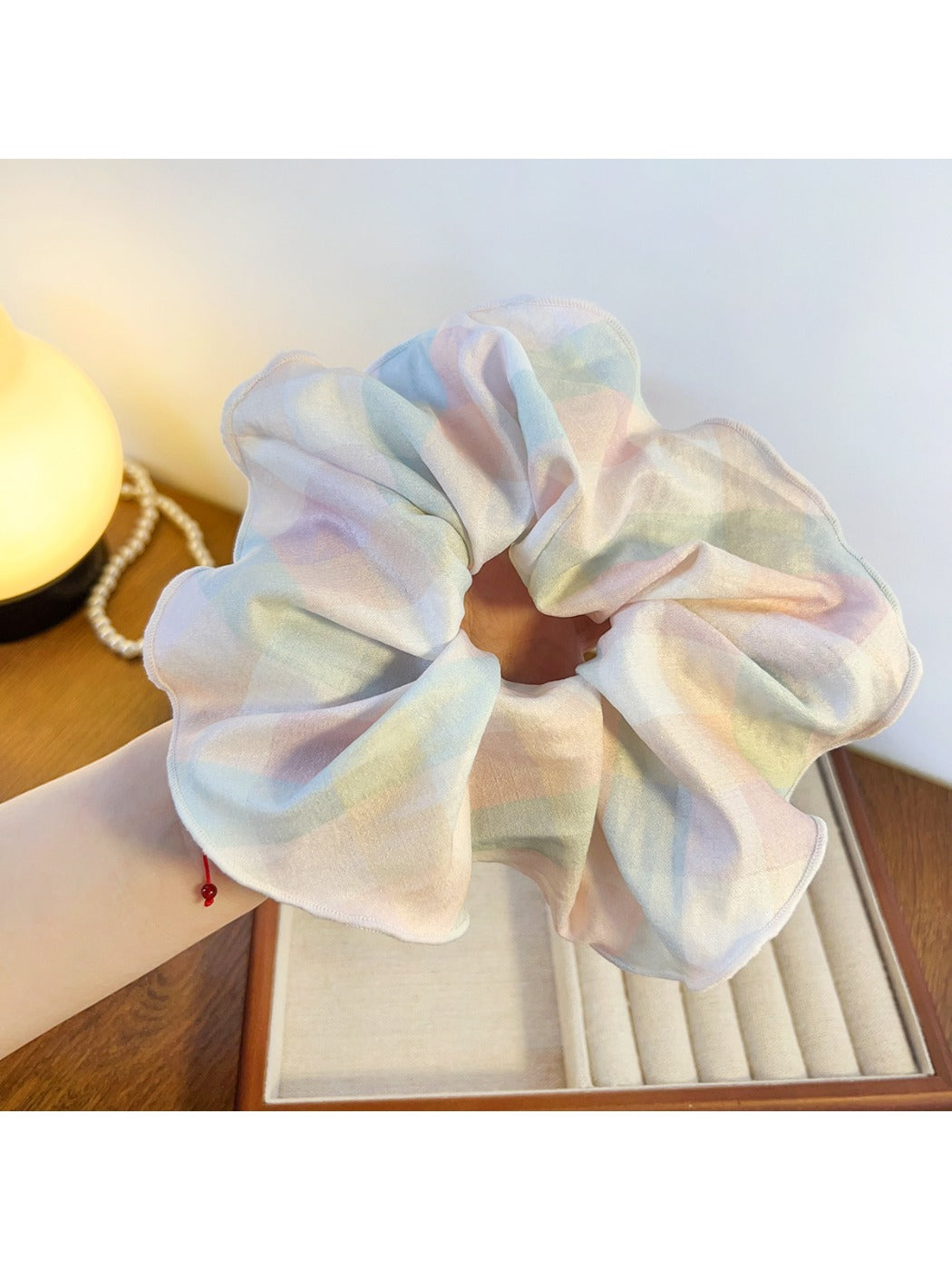Gifty minimalist colorful ruffled scrunchie styled in a ponytail on a model