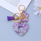 Close-up of polished silver heart cutout pendant on keyring