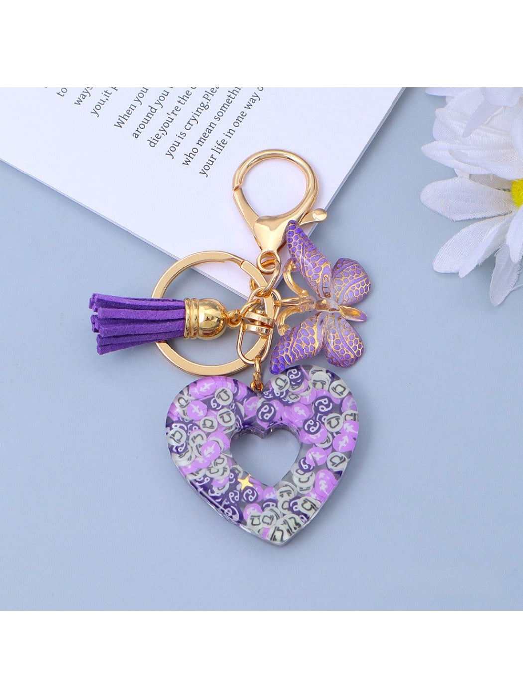 Close-up of polished silver heart cutout pendant on keyring