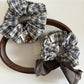 Side view of Gifty vintage plaid bow scrunchie showing fabric texture