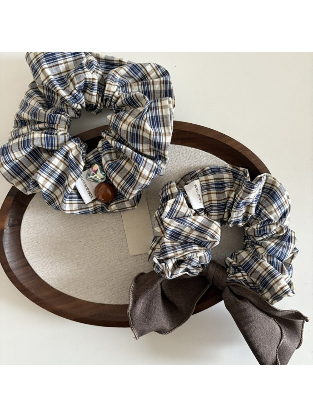 Side view of Gifty vintage plaid bow scrunchie showing fabric texture