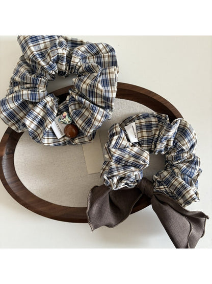 Side view of Gifty vintage plaid bow scrunchie showing fabric texture