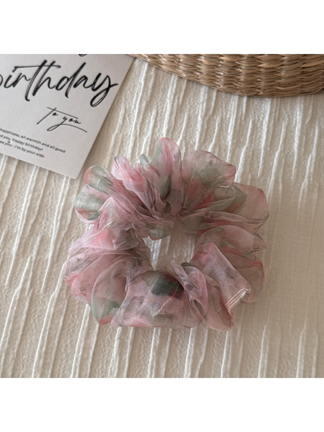 Scrunchie close-up showing fabric texture and floral details