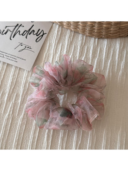 Scrunchie close-up showing fabric texture and floral details