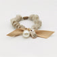 Side view of Gifty Sweet Bow Embellished Hair Tie highlighting the elastic band and bow
