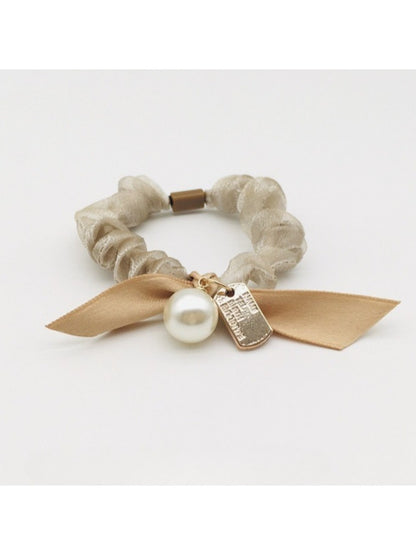 Side view of Gifty Sweet Bow Embellished Hair Tie highlighting the elastic band and bow
