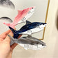 Beau shark shape claw clip open, showing spring mechanism and teeth