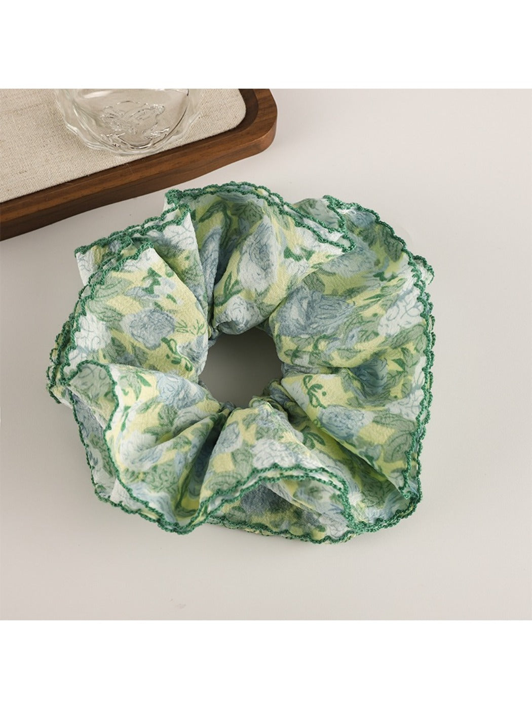 Flat lay of Gifty trendy floral print scrunchie on white background