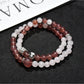 Close-up of Lovra color block bracelet showing smooth round beads in neutral tones