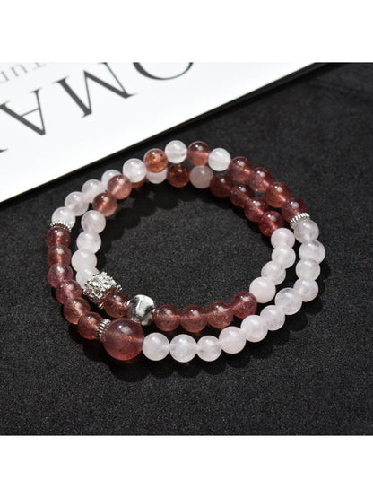 Close-up of Lovra color block bracelet showing smooth round beads in neutral tones