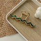 Beau wavy metal claw clip angled to show wavy design details