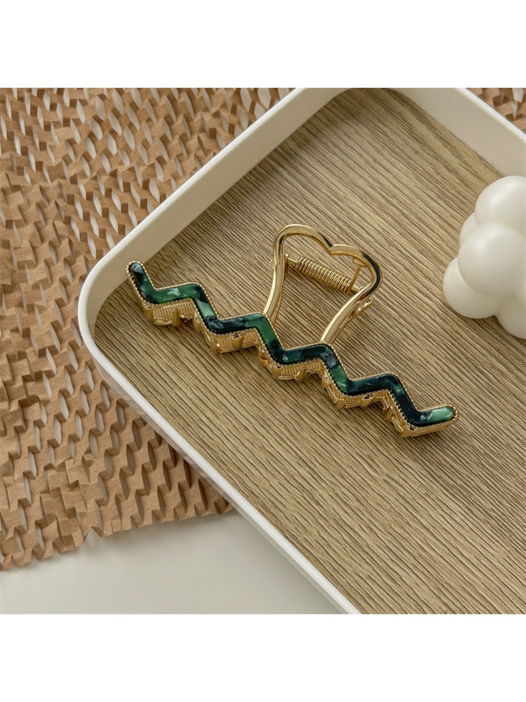 Beau wavy metal claw clip angled to show wavy design details