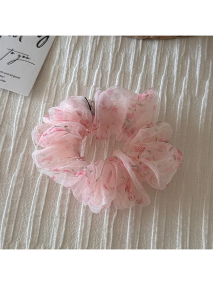 Scrunchie displayed flat highlighting multicolor floral print