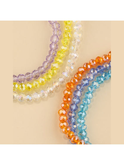 Multiple strands of Lovra beaded bracelet displayed on white background